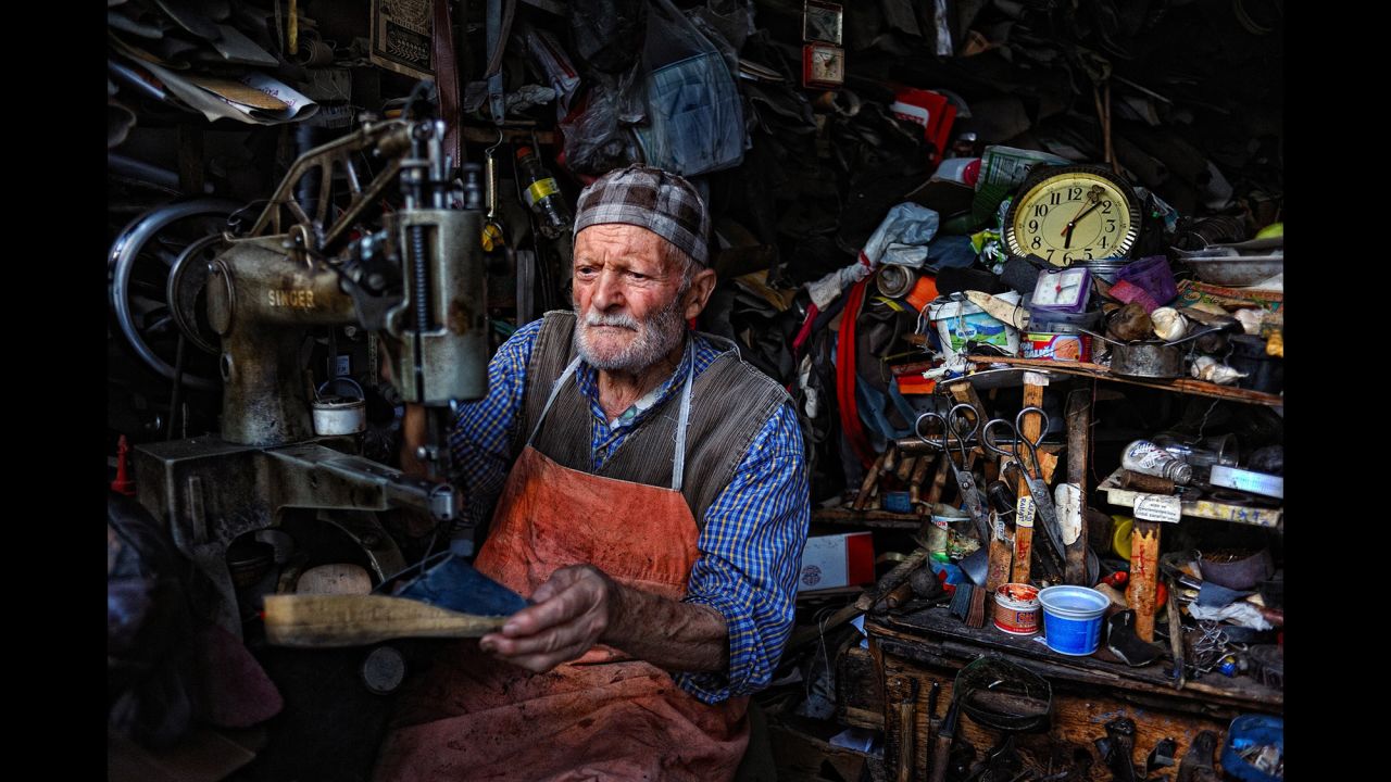 This 84-year-old Turkish man manages a shoe repair shop that affords him a decent income.