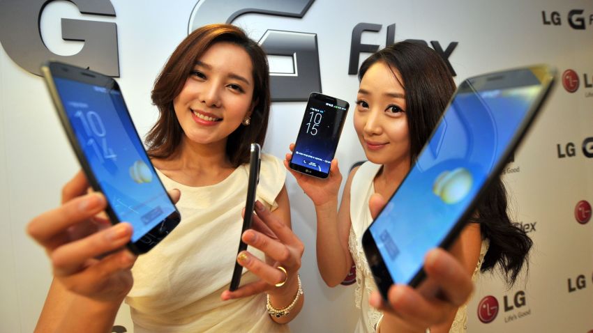 South Korean models show LG Electronics' curved-screen smartphone "G Flex" during a media event to unveil the new product at the company's headquarters in Seoul on November 5, 2013. The G Flex has a 6-inch plastic OLED display that curves inward from top and bottom. The device will hit the market in South Korea next week. AFP PHOTO / JUNG YEON-JEJUNG YEON-JE/AFP/Getty Images