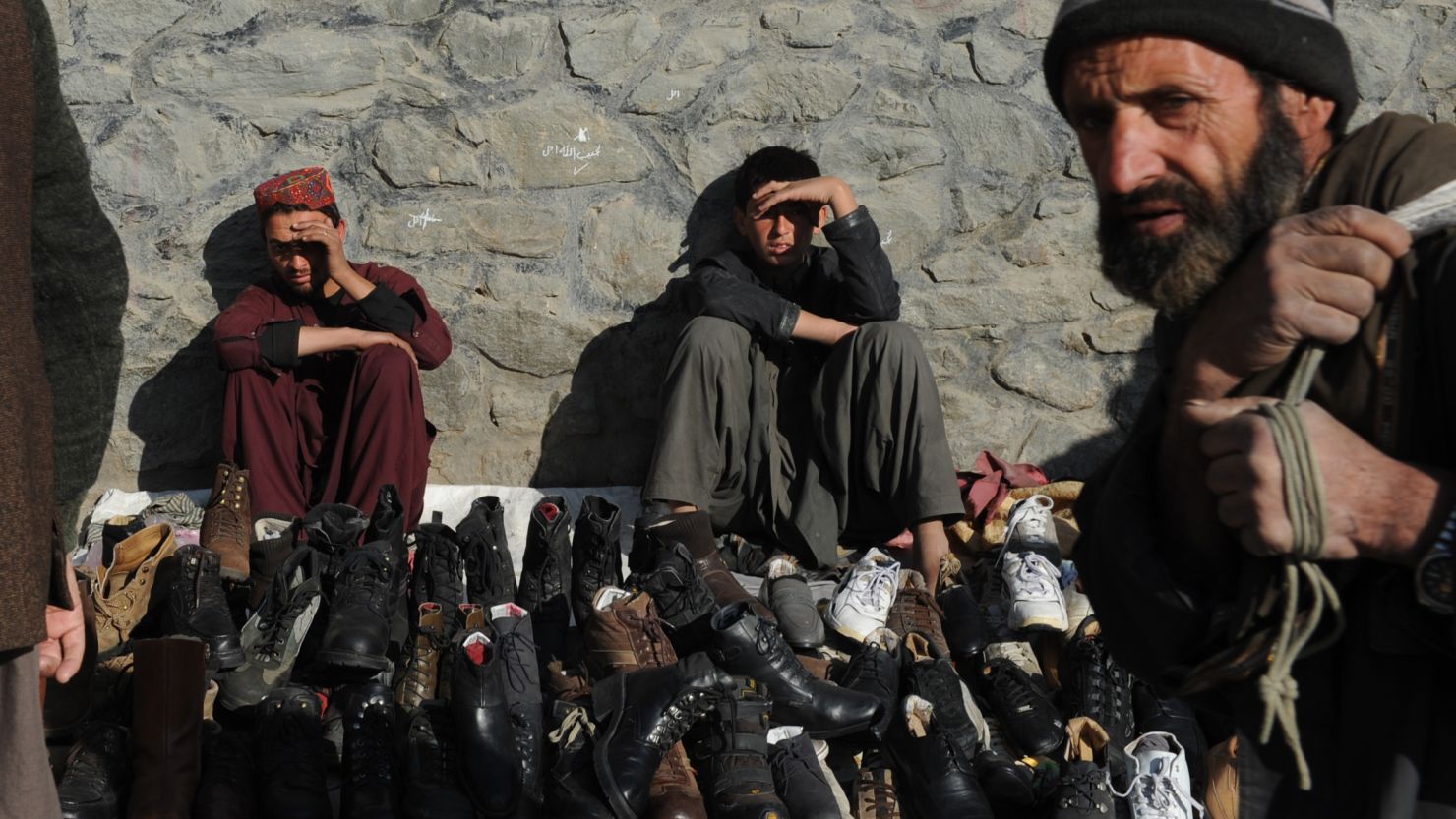 Afghan vendors sell shoes by a roadside on Wednesday as Kabul prepares for the Loya Jirga.