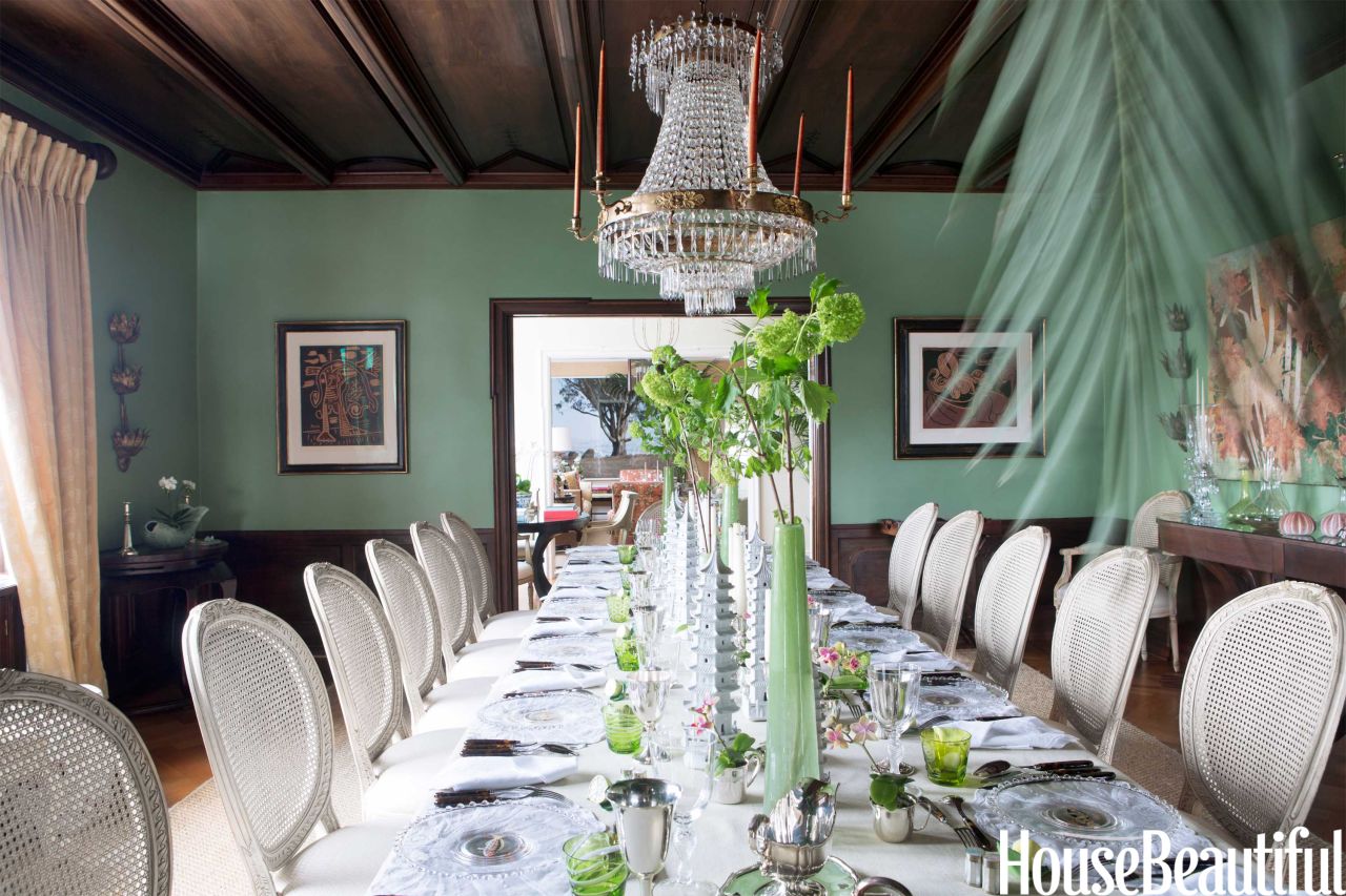 This dining room, decorated by Nicolette Horn and featured in the October 2013 issue of House Beautiful, includes very traditional but very dramatic furniture and fixtures.