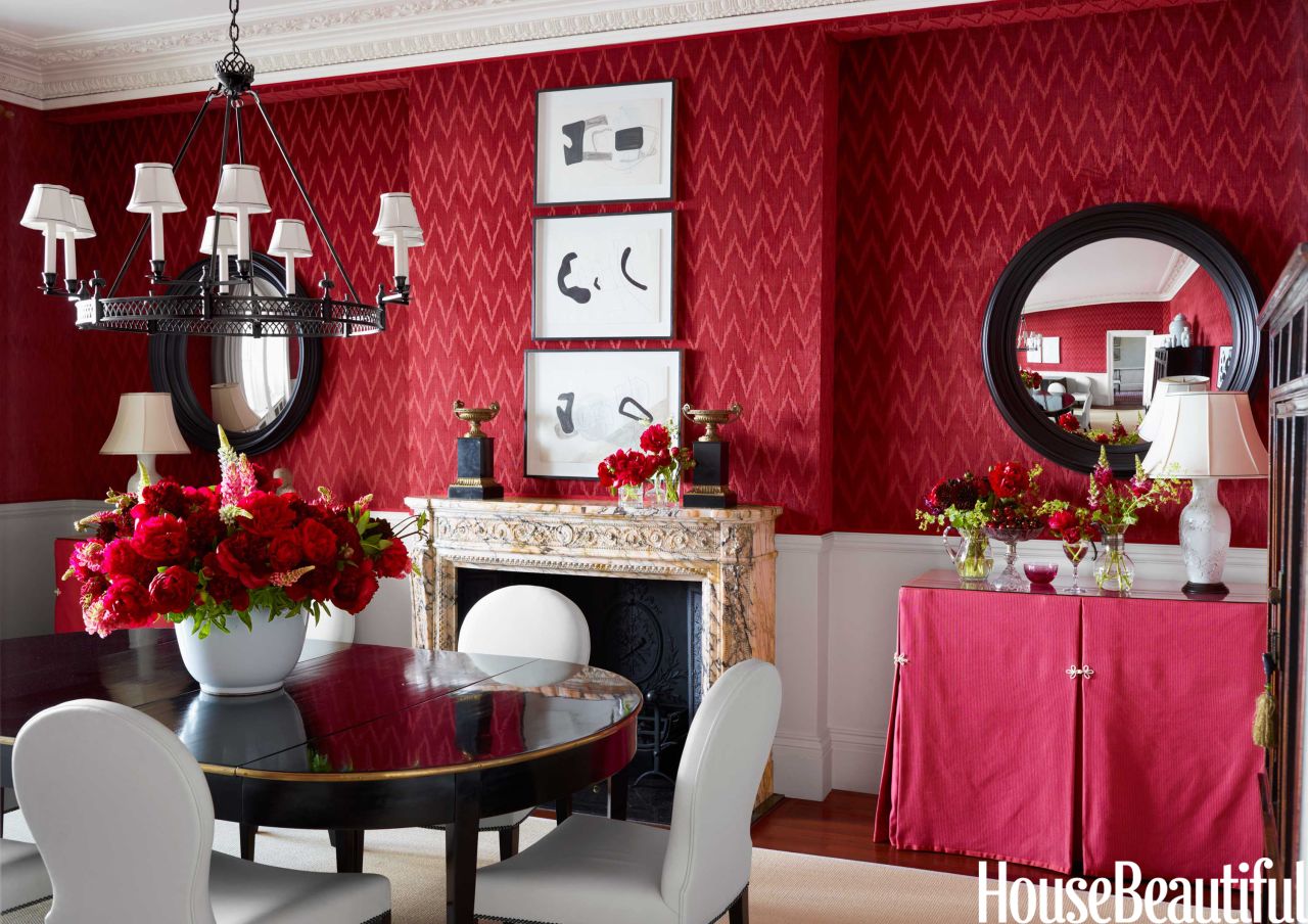 House Beautiful editor Shax Riegler says red is the most popular color for a dining room. Here, Rob Southern's dining room, featured in the October 2013 issue of House Beautiful, has traditional red walls done in a luxurious wallpaper.