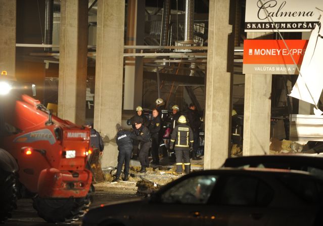 Rescue workers remove debris from the scene.