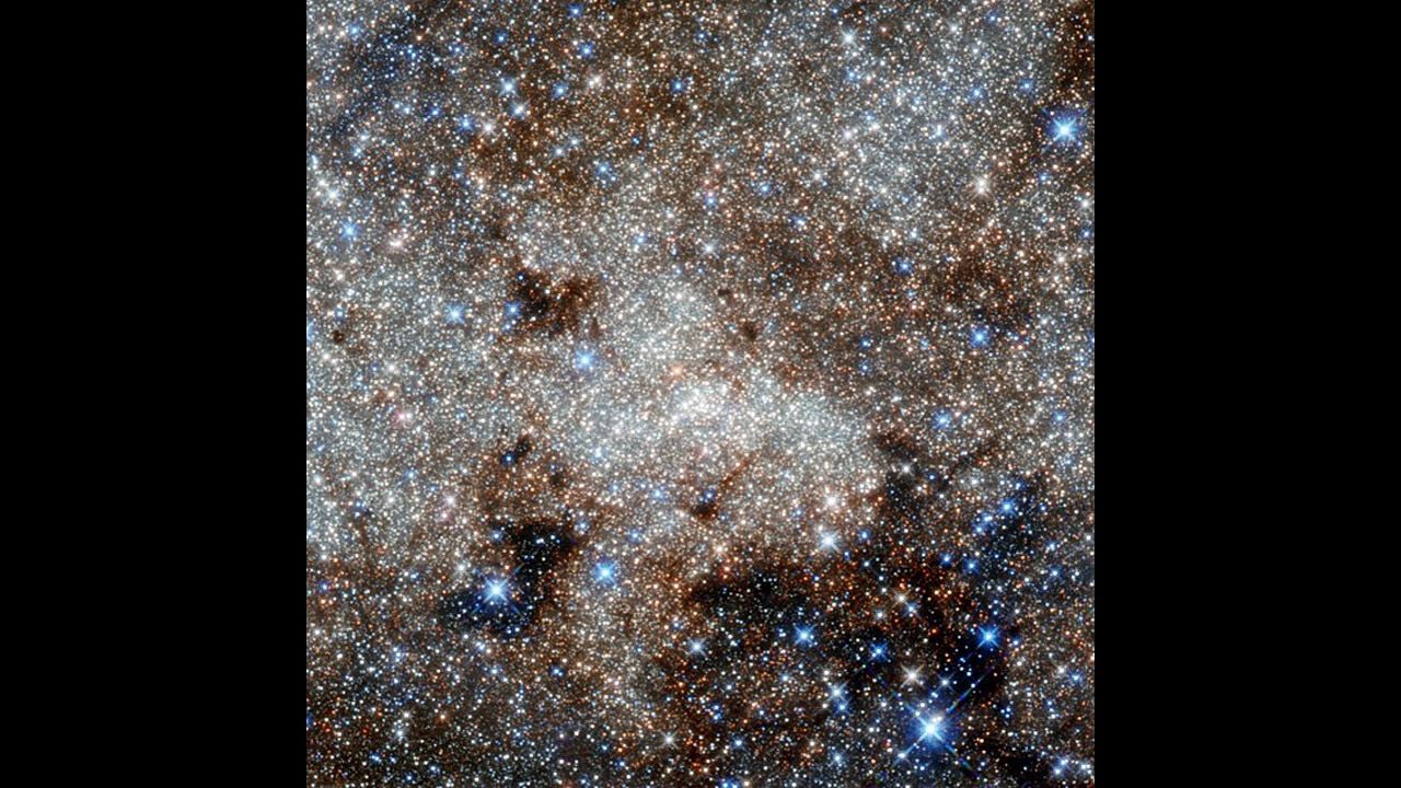 From the Hubble telescope: the crowded center of the Milky Way, showing the constellation Sagittarius. Right in the center of the image is a supermassive black hole called Sagittarius A*, consuming clouds of dust as it affects its environment with its enormous gravitational pull. 