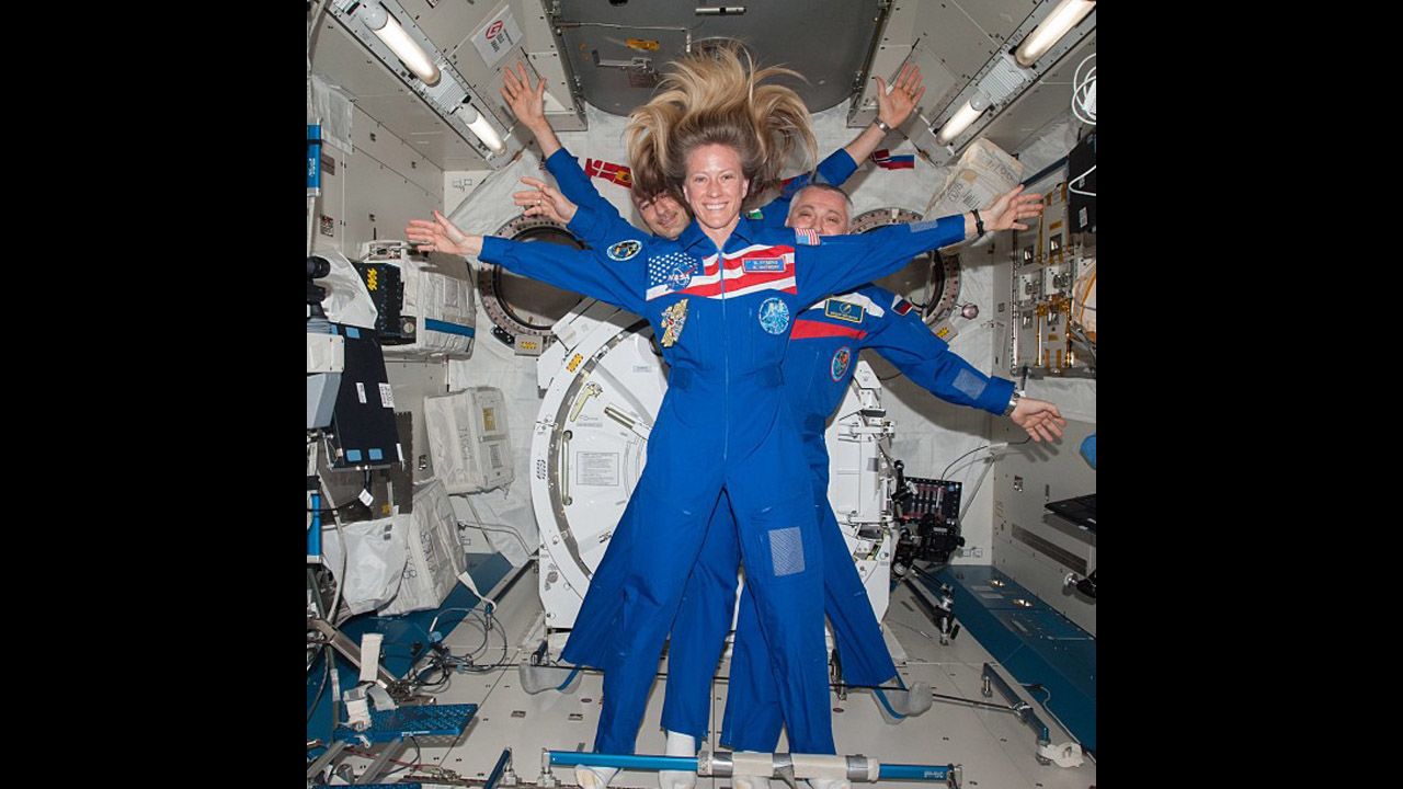 NASA astronaut Karen Nyberg takes a selfie with Russian cosmonaut Fyodor Yurchikhin and European Space Agency astronaut Luca Parmitano behind her.