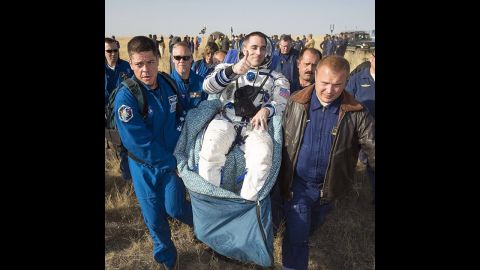 Expedition 36 flight engineer Chris Cassidy of NASA is carried to the medical tent shortly after landing in Kazakhstan on September 11, having spent five and a half months on the International Space Station.