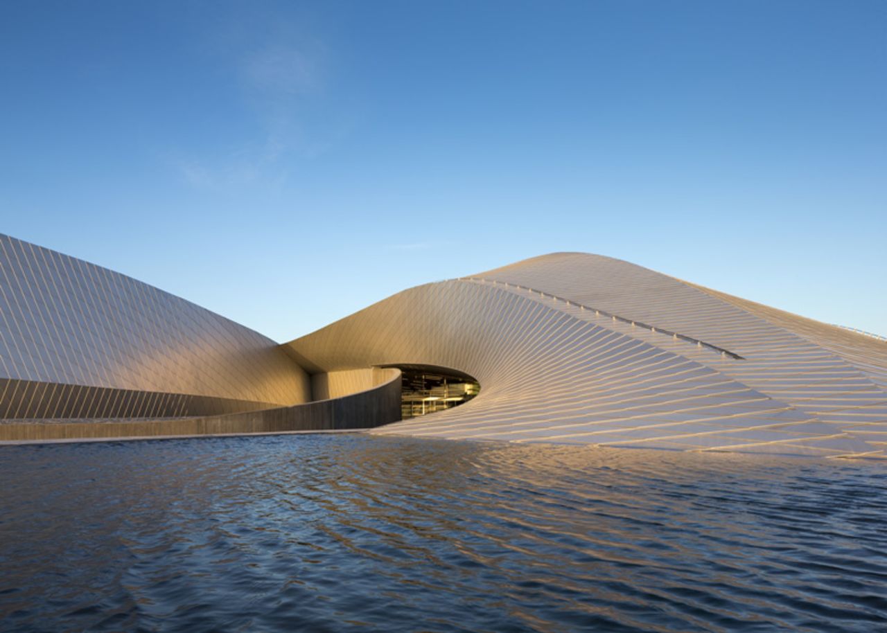 The Blue Planet in Copenhagen, northern Europe's largest aquarium, opened to the public in March. Located on the waterfront, its gently sloping wings resemble a whirlpool that binds the sea and land together. 