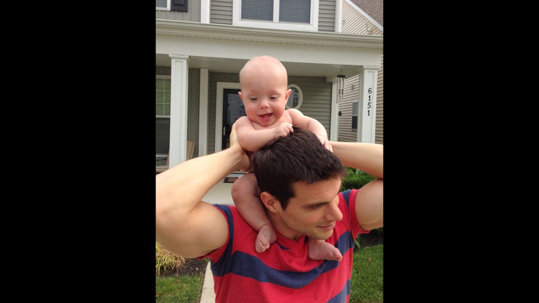 Ward gets a ride on his dad's shoulders.