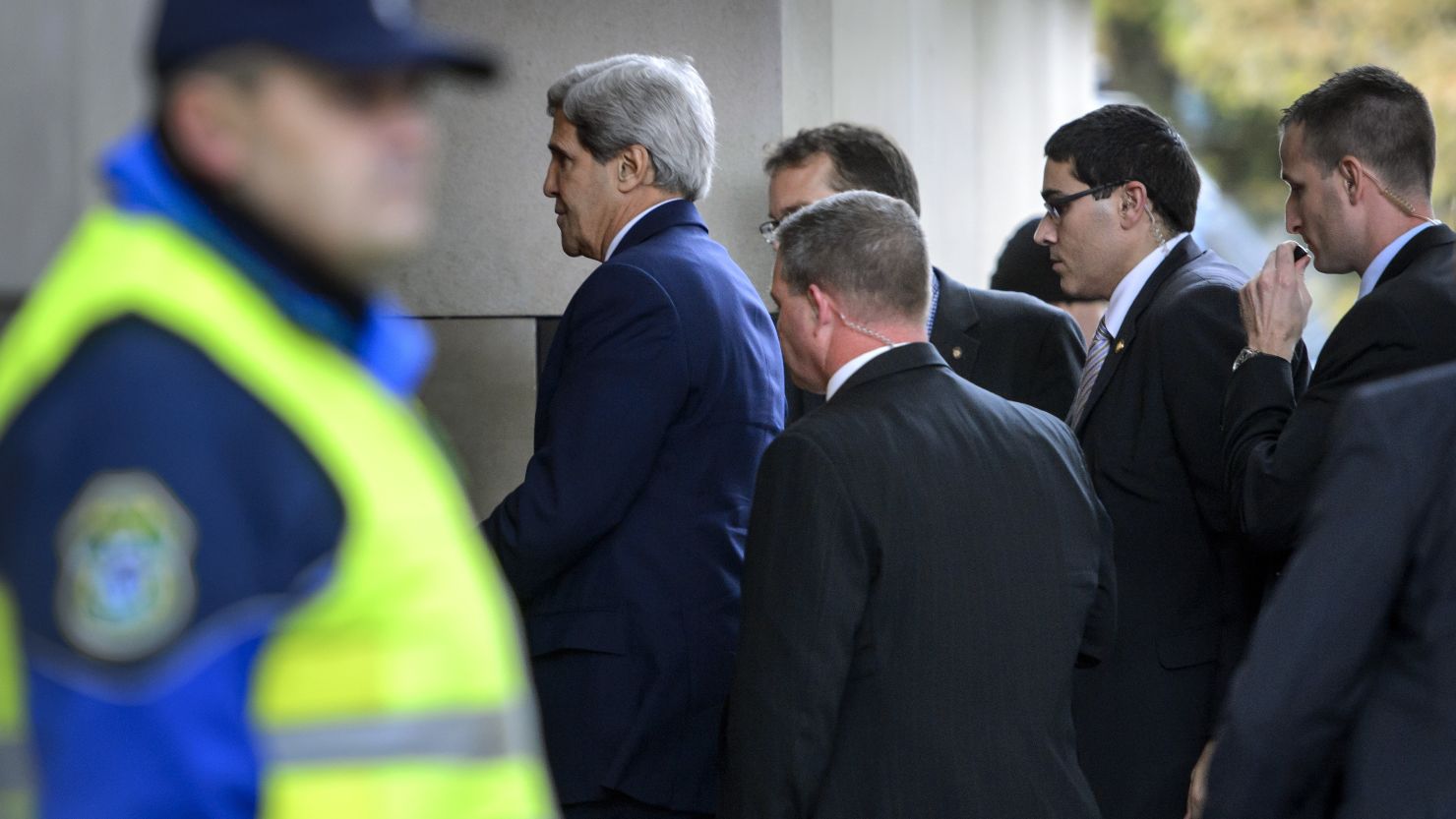 Secretary of State John Kerry, followed by bodyguards, enters the Intercontinental Hotel in Geneva for Iran talks on Saturday.