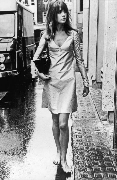 This shot of a barefoot Shrimpton on a rain-soaked street on her way to a fashion shoot typified the burgeoning non-conformism of young men and women in 1963.  