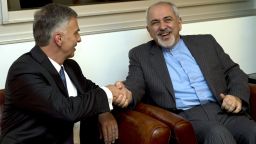 Switzerland's Foreign Minister Didier Burkhalter, left, shakes hands with Iranian Foreign Minister Mohammad-Javad Zarif, during a meeting at the Intercontinental Hotel prior to talks about Iran's nuclear programme in Geneva, Switzerland, on Saturday, November 23.