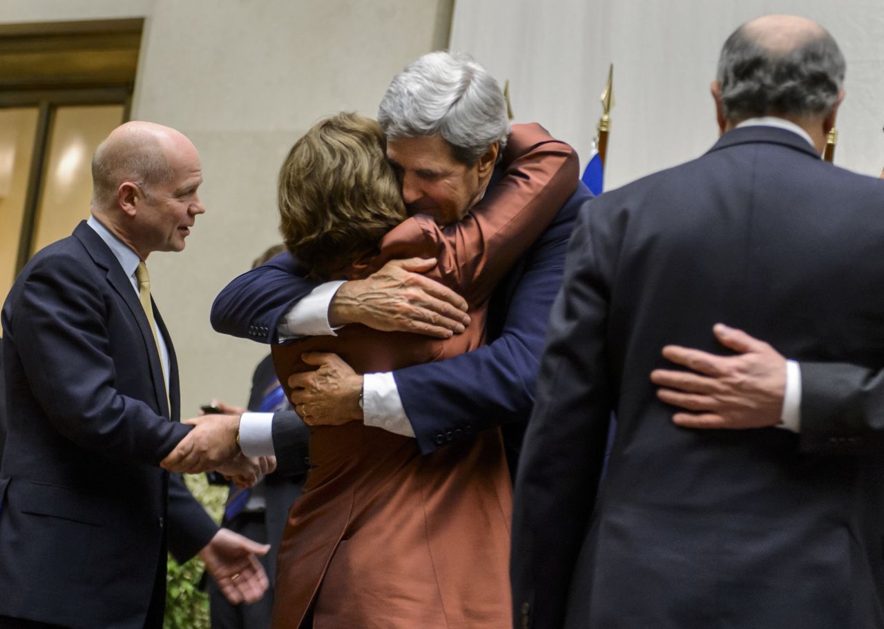 EU foreign policy chief Catherine Ashton and U.S. Secretary of State John Kerry embrace after the statement.
