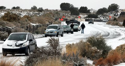 Cars slide on Paseo del Norte in Albuquerque on November 24.
