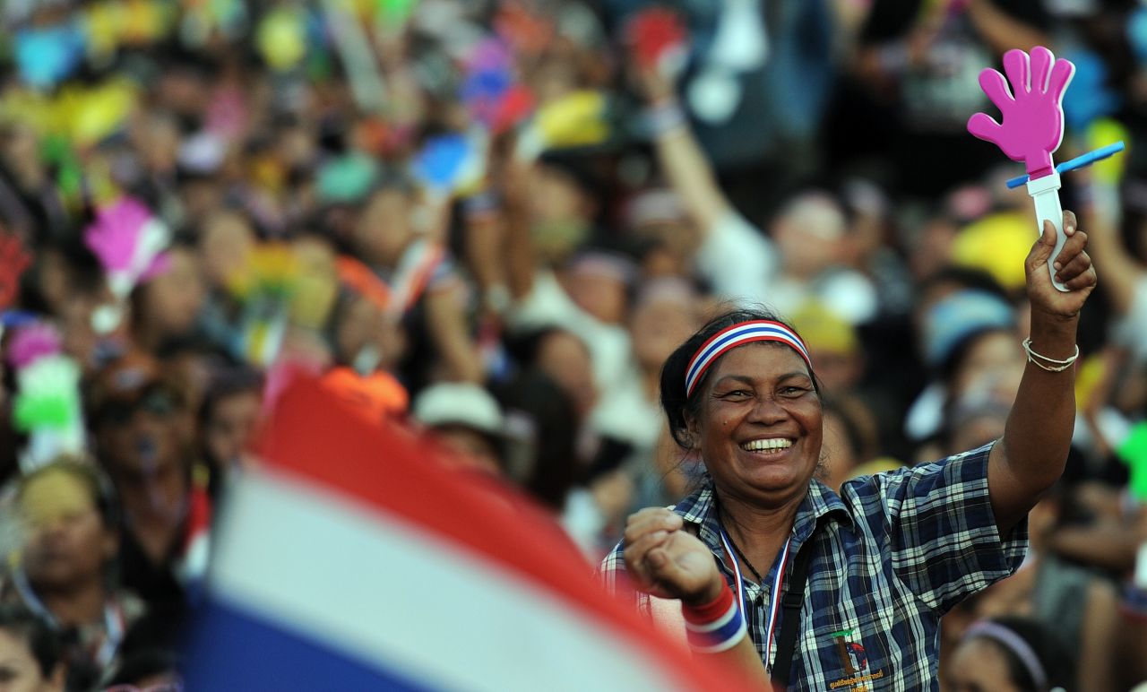 A Thai opposition protester waves a clapper during a rally at Bangkok's Democracy Monument Sunday.