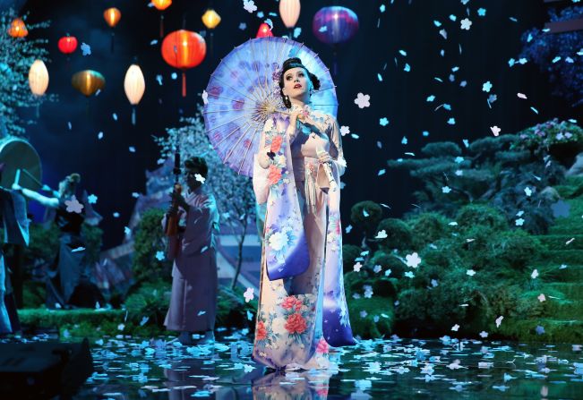 Katy Perry opens the show in full kimono on an Asian-inspired set for her song "Unconditionally."