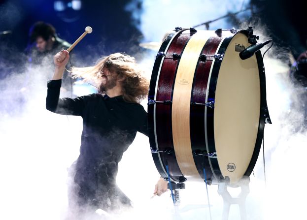 Wayne Sermon of Imagine Dragons bangs a drum during the band's performance.