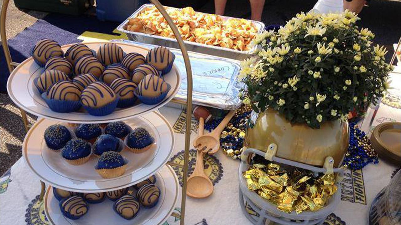 Wolnitzek uses blue and gold servingware -- and food! -- to create a fan-friendly ambiance at his tailgate.