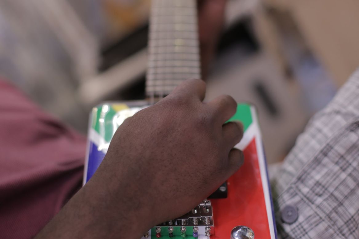 Electric guitars made from tin cans