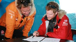 NOVO, ANTARCTICA - In this undated handout photo provided by Walking with the Wounded (WWTW) on November 23, 2013, Prince Harry, patron of Team UK in the Virgin Money South Pole Allied Challenge 2013 expedition, and Dominic West make notes of how much each individual and their kit weighs, during preparations in Novo, Antarctica. The team of 12 injured service personnel from Britain, America, Canada and Australia have overcome life-changing injuries and undertaken challenging training programmes to prepare themselves for the conditions they will face in Antarctica. Trekking around 15km to 20km per day, the teams will endure temperatures as low as minus 45C and 50mph winds as they pull their 70kg sleds to the south pole. (Photo by WWTW via Getty Images)