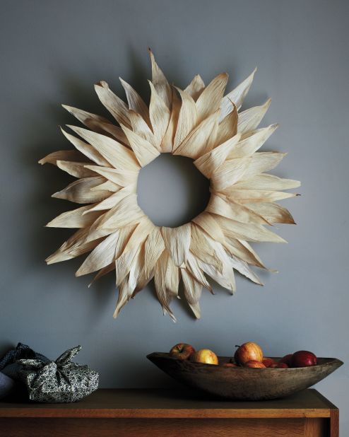 Homespun holiday: This wreath is a rustic nod to the harvest season, and it's made with tamale wrappers from the grocery store.<strong>Supplies: </strong>Corn husks, Bowl of water and paper towels, Straw wreath, T pins, Glue gun, Scissors