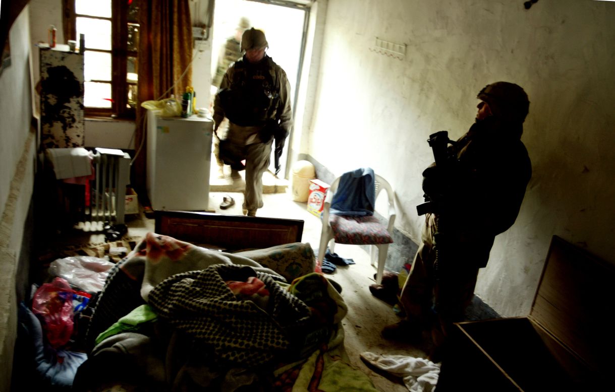 U.S. soldiers guard a small concrete room in the compound where Hussein was captured.