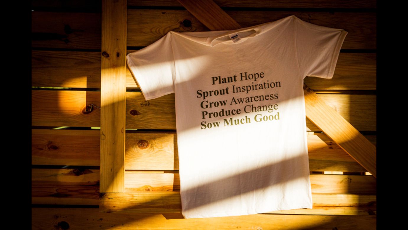 A T-shirt hangs on the wall of the Sow Much Good market.