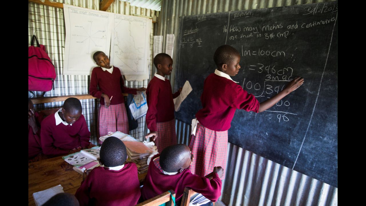 Students practice their math at Ntaiya's school. "Now, they can focus on their studies -- and on being kids," Ntaiya said. "It's the only way you can give a girl child a chance to excel."