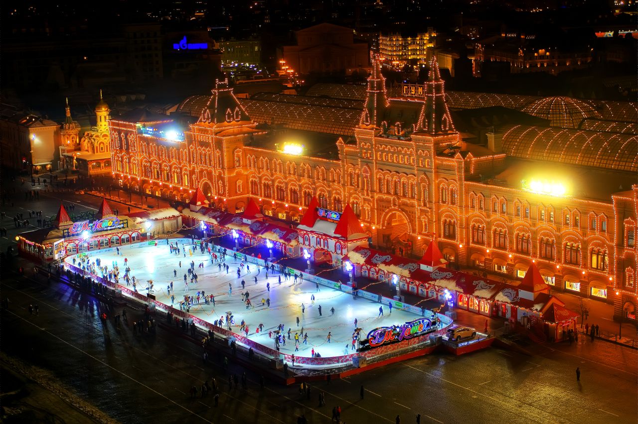 In winter, a quarter of Red Square is covered with a Christmas-decorated rink. Skaters speed in ovals below the Kremlin, St. Basil's Cathedral and the State Historical Museum.