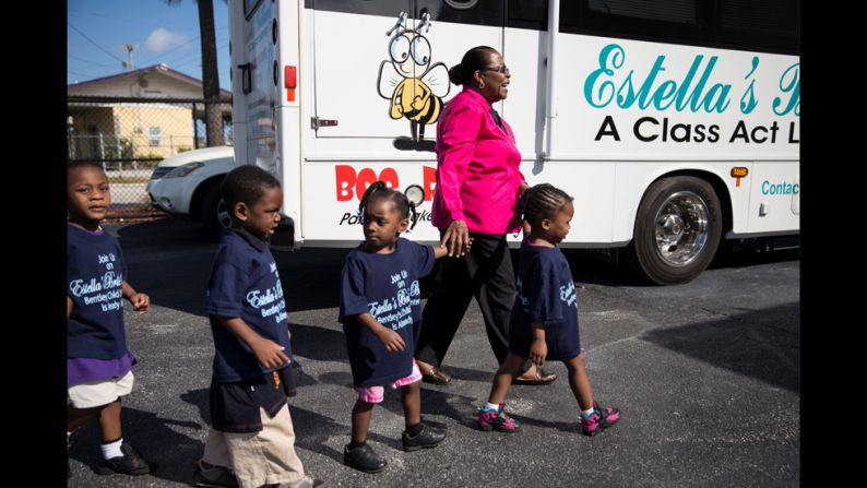 Pyfrom walks with children to the <a href="index.php?page=&url=http%3A%2F%2Fwww.estellasbrilliantbus.org%2F" target="_blank" target="_blank">Brilliant Bus</a>.