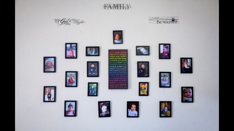 Photos are seen on the wall of the children's home in Cape Coral.