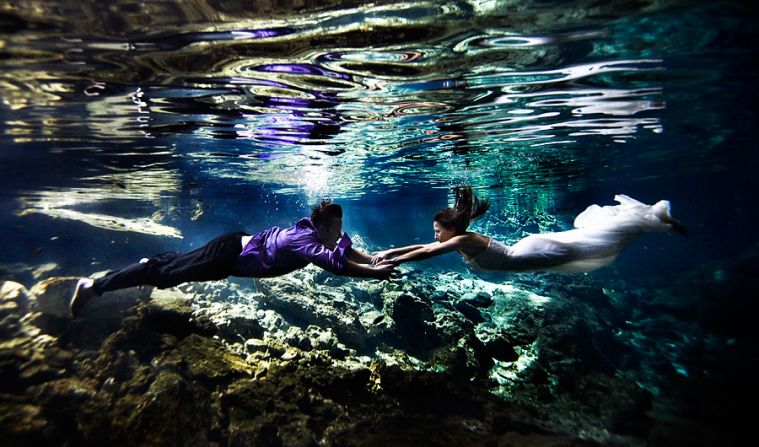 About 100 guests flew to Mexico for a wedding at the Blue Bay Grand Esmerelda. On a hunt for something more than the "regular beach image," the McLellan Style team and their newlyweds chose an underwater cave (cenote). "We tried shooting in all sorts of different areas with light coming in from different directions," says McLellan. The prolonged shoot led to this photo, a rushed drive to the airport, a speeding ticket and a missed flight. "But that's OK, it was worth it," says McLellan.