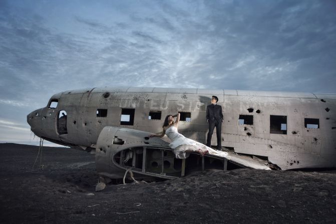 Sean McLellan, of husband-and-wife team McLellan Style, worked with a New York couple who chose Iceland for their wedding photographs. The Nashville-based photographer knew of a U.S. Navy plane that had crash-landed in the 1970s. Despite a satellite picture from Google Maps and GPS coordinates, it took the photographer and couple more than three hours to  find the plane. "This image was actually taken at close to midnight by the time we were able to get there and get everything set up." 