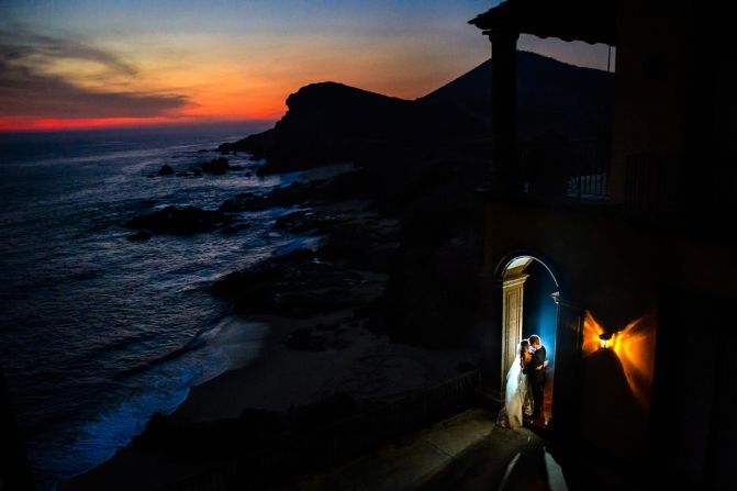 Todos Santos is a laid-back beach town north of Cabo San Lucas. Despite a late ceremony time, Chrisman was determined to capture a dramatic sunset. "A bit of flash helped illuminate Apollina and Brad, and the light on the side (of the Hacienda Cerritos) balanced nicely with the colors of the sunset," says Chrisman.