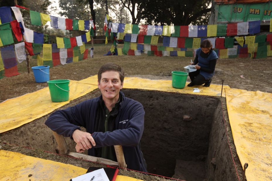 Archaeologist Robin Coningham of Durham University in the United Kingdom emerges from the dig at the Lumbini Village Mound in Nepal. He led a study describing the oldest Buddhist shrine ever found.