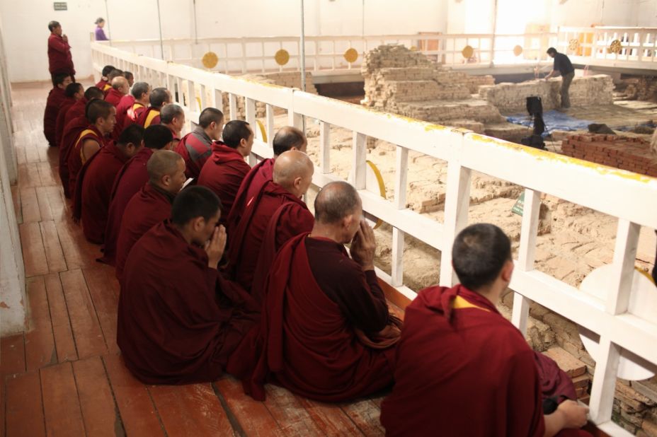 Monks chant within the Maya Devi Temple, which enshrines the Buddha's birthplace, at Lumbini in Nepal. 