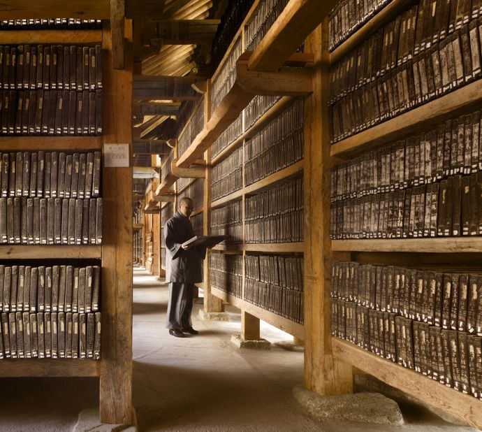 <em>Tripitaka Koreana, Haeinsa Temple, South Korea</em><br /><br /><a href="http://www.thamesandhudson.com/The_Library/9780500342886" target="_blank" target="_blank">The Library: A World History</a><strong> </strong>is the most complete account of library buildings to date. Here James Campbell and Will Pryce take us on a virtual journey through some of their favorites.<br /><br /><strong>Will Pryce</strong>: "Visiting this library was an extraordinary, if fraught, experience. We hiked up a mountain only to be told that we weren't allowed to photograph the interior. Fortunately we had a Korean student of James's with us who pleaded with the Abbott and little by little we negotiated our way in. First we could take a picture through the door, then from just inside and so on. The collection is revelatory because you realize that you are looking, not at books, but printing blocks and that they date from 1251 -- reminding us that the Koreans were printing for centuries before Gutenberg."