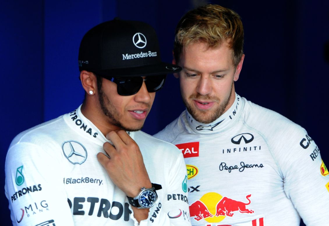 Mercedes driver Lewis Hamilton (left) says Vettel has been able to cruise to wins this season but he is one of several top drivers aiming to stop the German's era of dominance when new rules changes shake up the sport in 2014.
