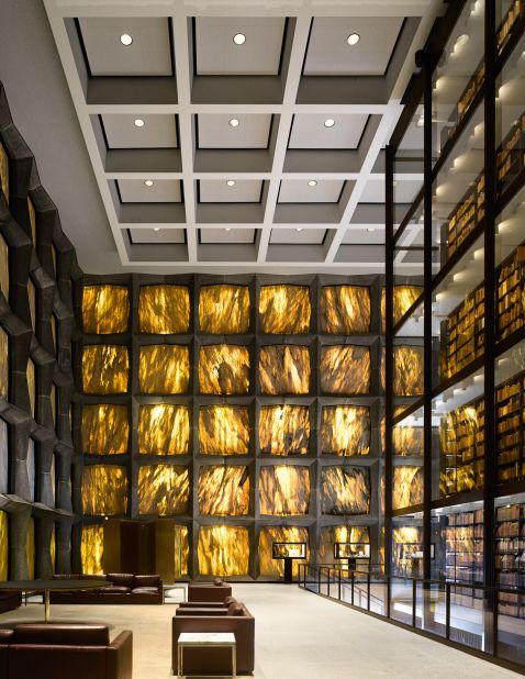 <em>Beinecke Rare Book and Manuscript Library, New Haven, U.S.</em><br /><br /><strong>James Campbel</strong>l: "Outside it looks like a white box, so there is an element of surprise when you go in. All light comes through the stones in the wall, and the honey-color trickle of sun rays makes it magical. It is one of the largest buildings in the world devoted entirely to rare books and manuscripts, and it is celebrating its 50th anniversary this year. The elegance of the Beinecke later inspired the glass-walled structure that holds the original core collection of the British Library."<br />