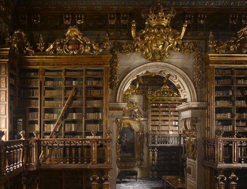 <em>Biblioteca Joanina, Coimbra, Portugal</em><br /><br /><strong>Will Pryce</strong>: "This is a very imposing library from a time when Portugal was extremely wealthy and powerful. It is very dark but features intricate gold leaf which gives it magical luminosity. The backs of the bookcases each have different color, and there are integrated ladders that pull out, and secret doors that lead to reading rooms."