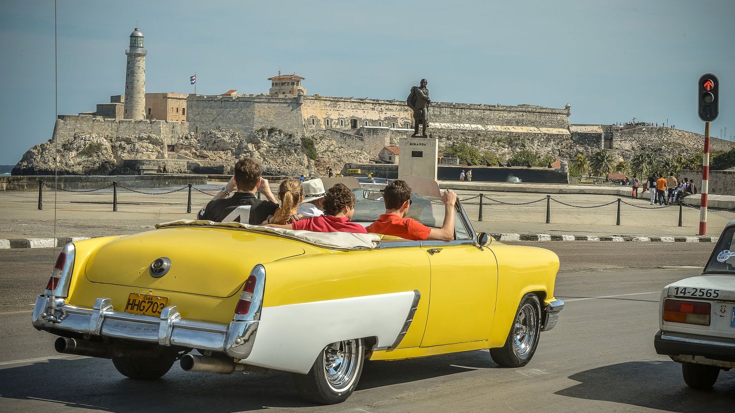 Tourists take a ride along the coast in Havana, which may become even harder for U.S. citizens and Cuban expats to reach after Cuba's government suspended all consular services to the United States on Tuesday.
