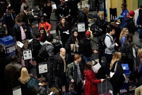 Travelers wait in security lines at Reagan National Airport on November 26.