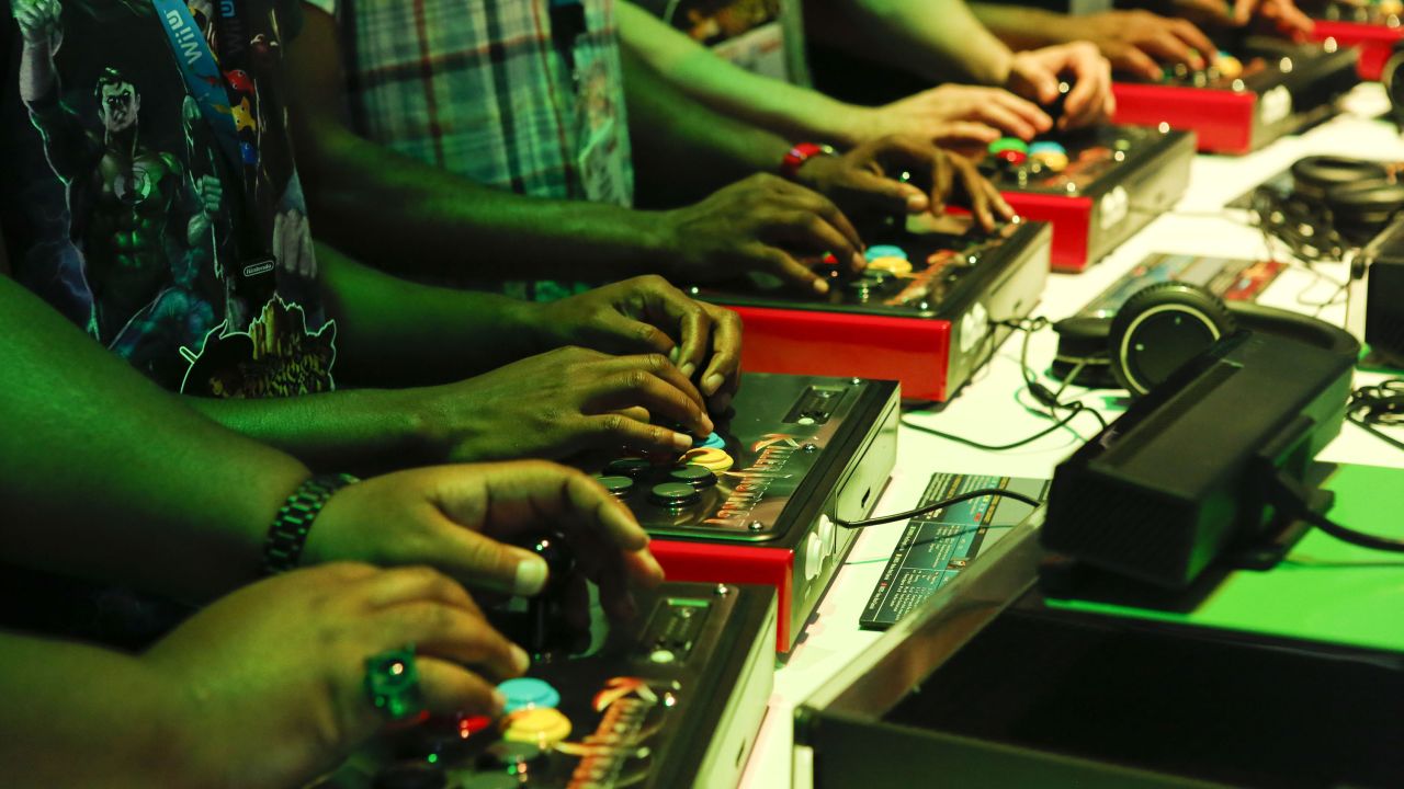 Gamers, like these at the E3 expo in June, have three good options when considering gaming consoles this  holiday season.