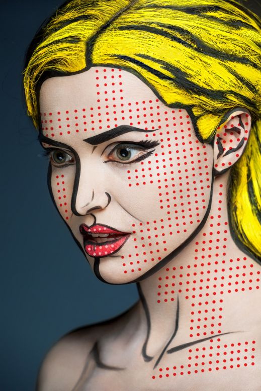 Russian makeup artist Valeriya Kutsan's new series "2D or not 2D" transforms the faces of her subjects into works of pop art. In this image, the model's skin is covered in small red dots and her hair is painted with a bright yellow color to recreate one of Roy  Lichtenstein's comic-style paintings. 
