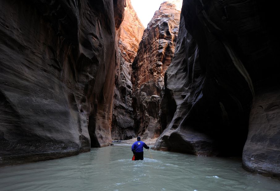 Zion National Park in Utah remained in seventh place on the park service's list of most popular national parks for the second year in a row. Here, a hiker wades up the Virgin River in the Zion Narrows. 
