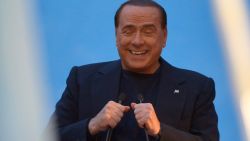 Italy's former Prime Minister Silvio Berlusconi delivers a speech outside his private residence, the Palazzo Grazioli, on November 27, 2013 in Rome. 
