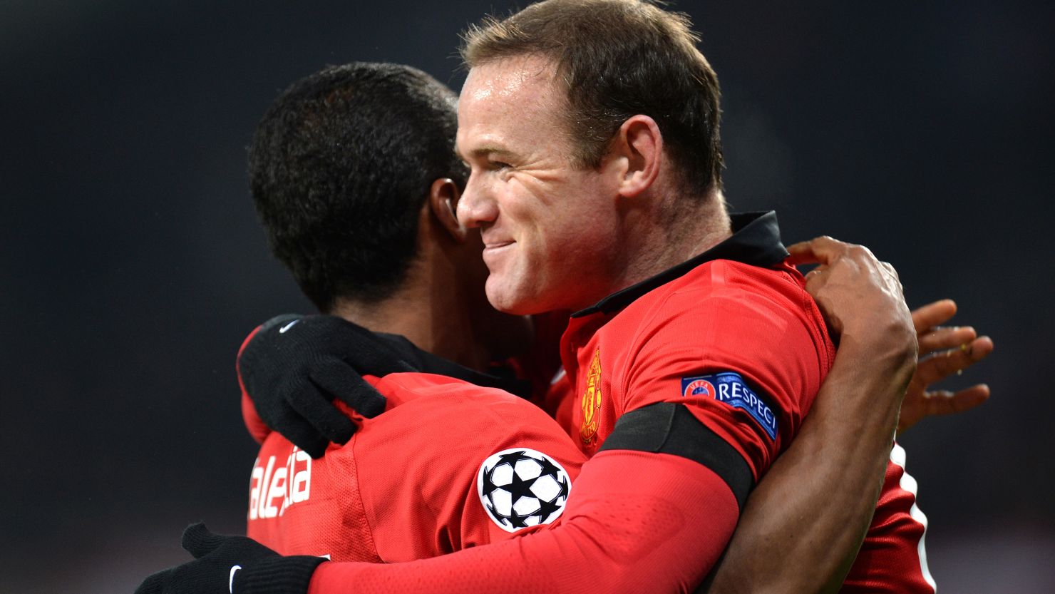 Wayne Rooney celebrates with Antonio Valencia following the winger's opening goal for Manchester United.