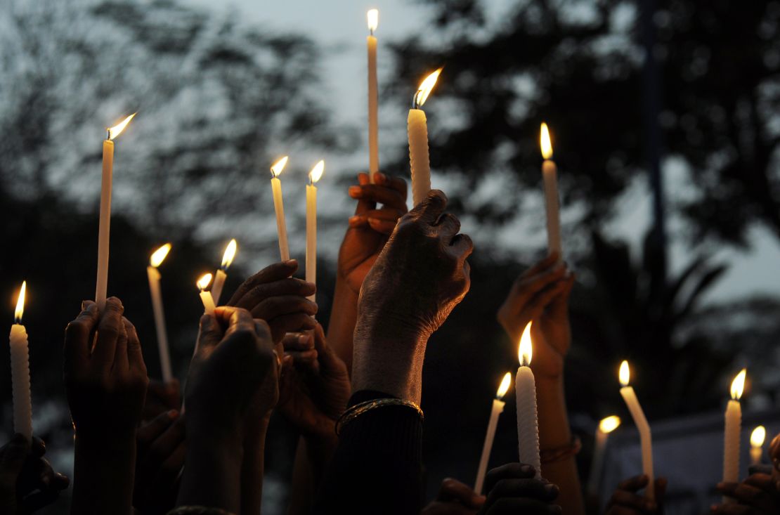 Indian activists hold a candlelight vigil on December 30, 2013 after the death of Nirbhaya.