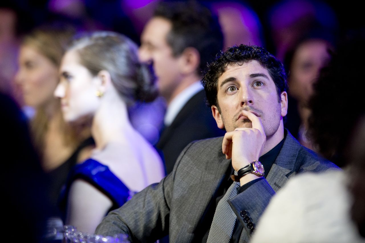 Actor Jason Biggs listens to presenters during the show.