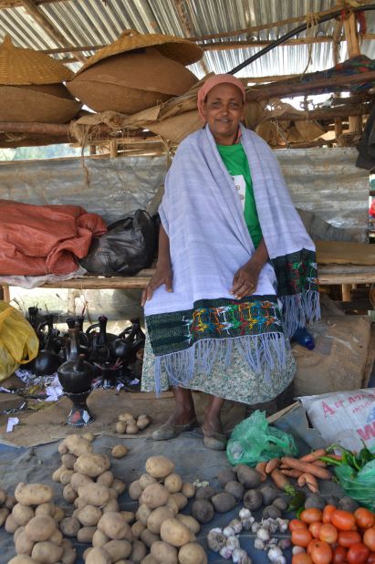 Volunteer Alemitu Yemes pictured at her market stall.<br />She has four children of her own and two foster kids, as well as looking after 25 kids from the Yekokeb Berhan program. She's given a small room in her compound, rent free, to a family of five. Everyone except the youngest child is HIV positive. 