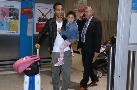 The 34-year-old, here holding one of his two young daughters, had not been able to leave Qatar after he filed a complaint against his club Al-Jaish over a payment dispute. 