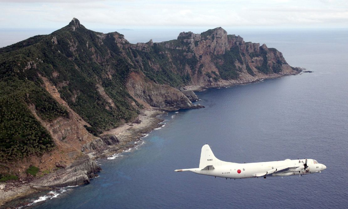 A Japanese military plane flies over the Senakuku/Diaoyu islands in this file photo.